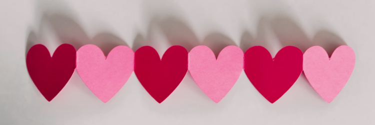 A string of red and pink paper hearts